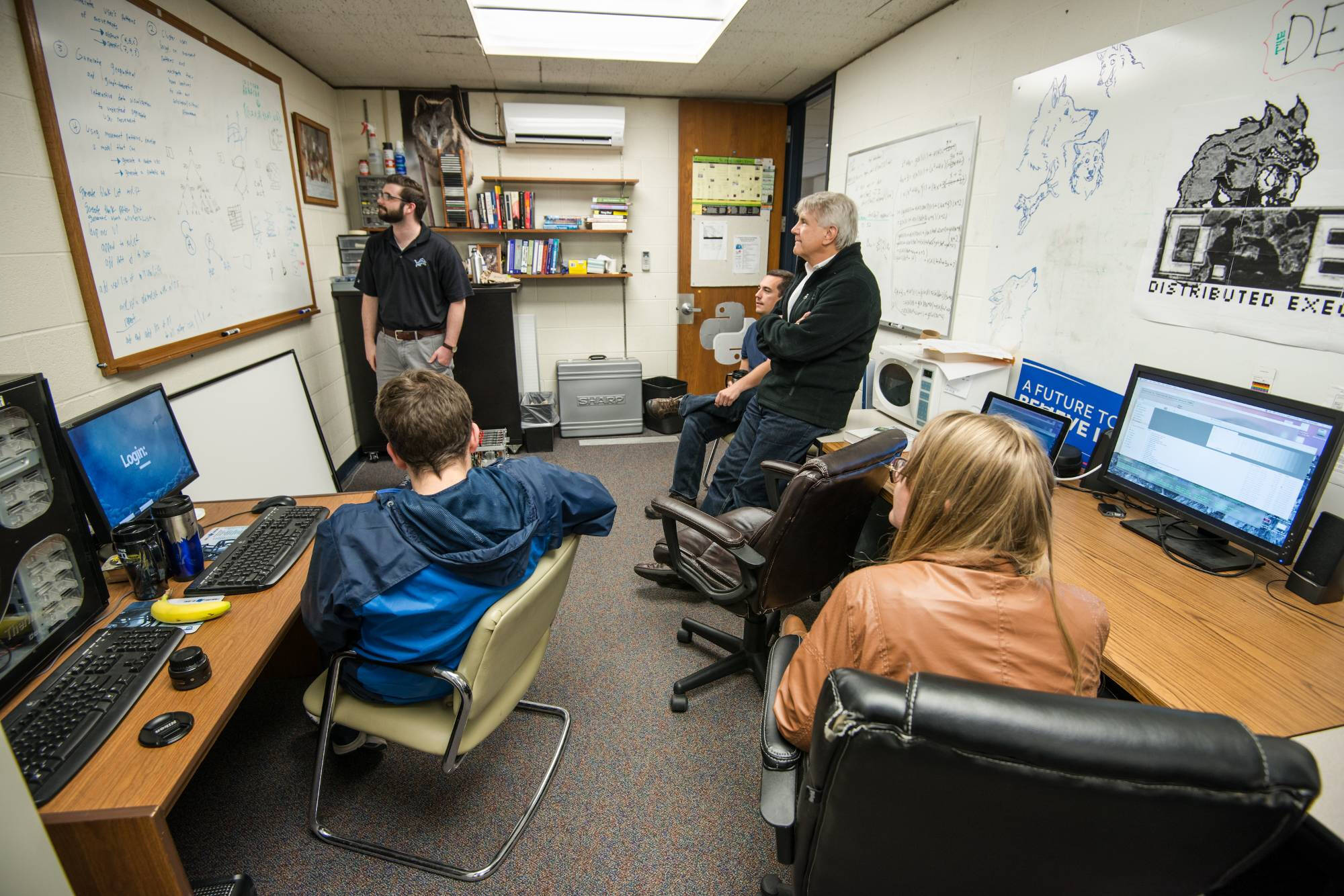 Students with Prof Wolffe inside DEN lab